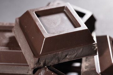 Pieces of chocolate on dark background