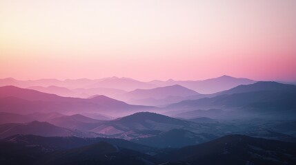 Obraz premium Ambient twilight hues envelop a series of dusky mountain ranges, offering a serene and calming landscape view that transitions beautifully from day to night.