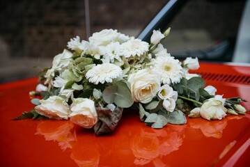 Bouquet on Vintage Red Car Hood