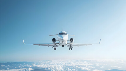 Obraz premium White Jet Aircraft Flying in a Clear Blue Sky Above the Clouds