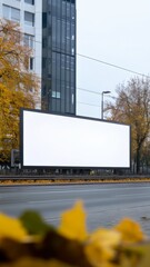 Obraz premium blank mockup billboard on city street during autumn, perfect for outdoor advertisement