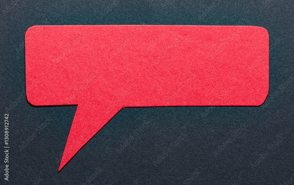 Poster Red cut out blank paper speech bubble of rectangular shape and rounded corners with copy space for text on dark background, flat lay top view conceptual backdrop