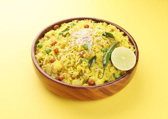 Indian Breakfast Dish Poha Also Know as Pohe or Aalu poha made up of Beaten Rice or Flattened Rice. The rice flakes are lightly fried in oil with mustard, chilly, onion, curry leaves and turmeric   

