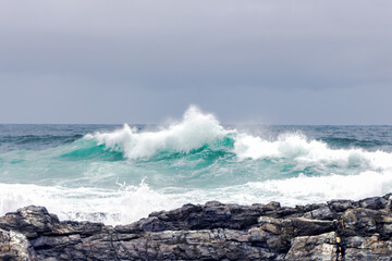 Large Indian Ocean waves and rocky coastline in Tsitsikamma, Garden Route National Park, Eastern Cape. South Africa	