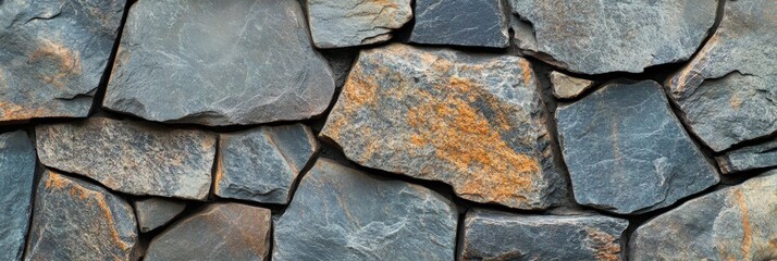 Fototapeta premium A closeup view of a stone wall with closely arranged bricks