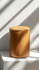 Elegant Wooden Container with Lid on White Surface and Natural Light Shadows at Daytime Display
