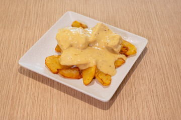 A plate of food with a creamy sauce on top of it
