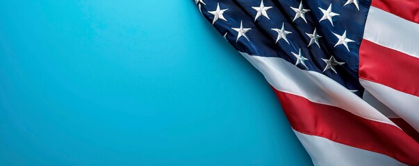Obraz premium American Flag Displayed on a Blue Backdrop Representing Patriotism and National Pride Celebration