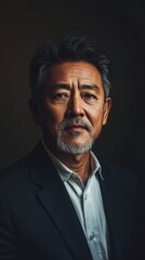 Fototapeta premium Mature Asian Man in Formal Business Attire