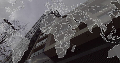 Image of cityscape over world map