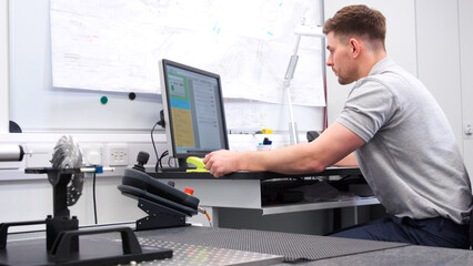 Male Engineer Uses CMM Coordinate Measuring Machine In Factory