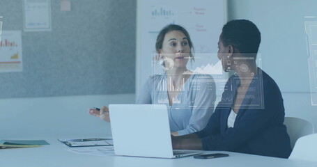 Image of financial data processing over diverse businesswomen in office