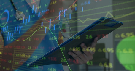 Holding clipboard, medical professional with stethoscope over financial data image