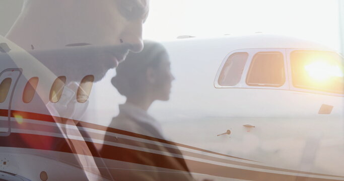 Business jet flying with businessperson working on tablet image