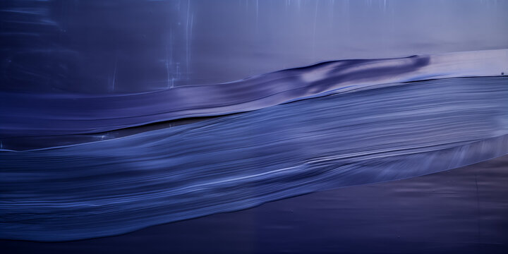 A serene wave captured in calming blue tones, evoking tranquility and peace.