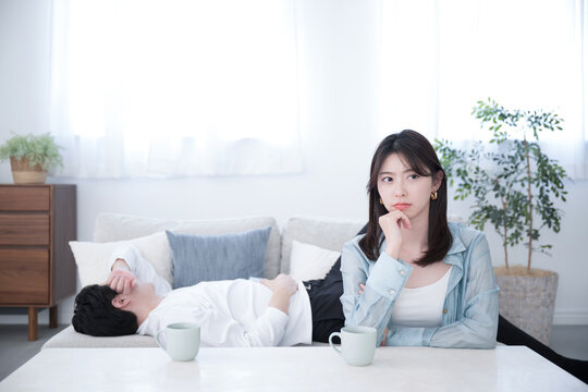 A difficult image of a couple fighting because the husband sleeps around on holidays Negative image of a wife's angry, troubled, and distressed face