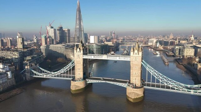 Breathtaking aerial pan of Tower Bridge, London, capturing its historic charm and the stunning South Bank skyline. Perfect drone footage for cinematic, travel, and documentary projects.