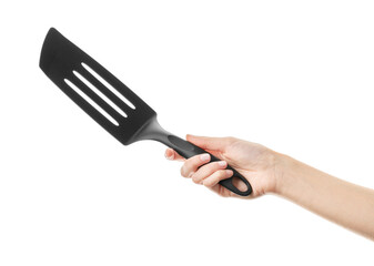 Ladle, turner, kitchen utensils isolated on white. Kitchen spatula on isolated white background. Black plastic kitchen spatula isolated on white background. A set of kitchen utensils.