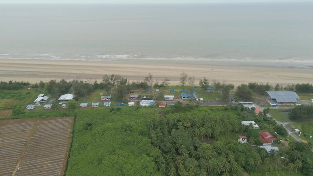 Beautiful Aerial Drone View Summer At Tanjung Kembang Water Park Beach Kabong , White Sandy Beaches, Coconut,And Palm Oil Plantation,Longe House,Homestay,Seratok,Sarawak,Borneo.