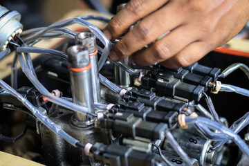 Obraz premium Installing Control Valve Automatic Transmission in workshop services, assembly automatic transmission at Transindo Balikpapan