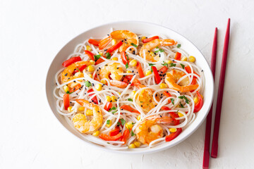Rice noodles with shrimp, pepper and corn. Seafood. Asian cuisine.