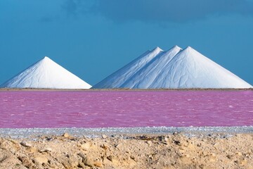 The Salty Pyramids viewed through pink saline lake, Bonaire, Caribbean Netherlands