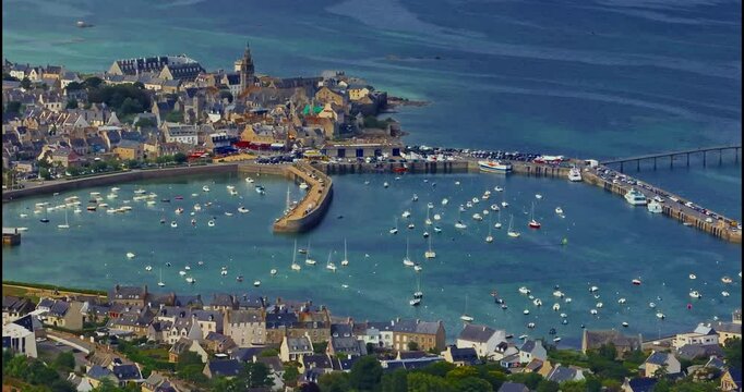 Aerial view of Roscoff cityscape, with Roscoff jetty in the background in northwestern France. Picturesque fishing and tourist town on the Atlantic coast Roscoff in the sunset