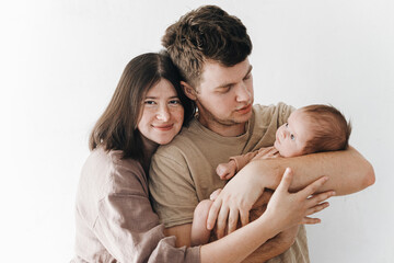 Happy mother and father hugging little baby son. Happy Mothers day and Happy Fathers day! Motherhood and parenthood. Adoption and fertility concept