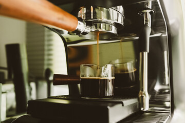  flowing of espresso coffee the medium machine, brewing a perfect roast with smooth crema and aromatic depth. A true coffee lover moment.