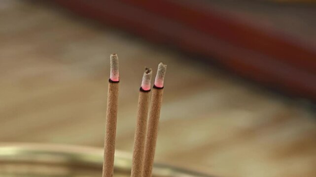 Incense sticks smoldering in temple.