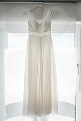Elegant White Wedding Dress on Hanger