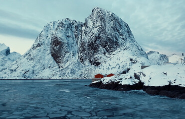A Majestic SnowCapped Mountain rising majestically in a stunning Arctic Landscape scene