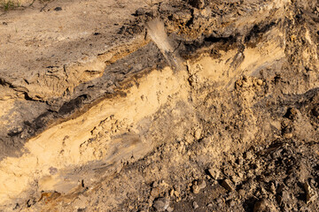 hole in the ground on the site of which a highway was started