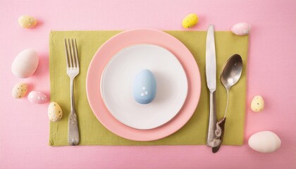 Easter table setting with cutlery plates dinnerware easter egg Pastel colored photo taken from above overhead 