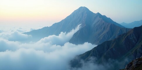 Fototapeta premium Fog slowly lifting to reveal the rugged landscape of a cloud-covered peak, atmospheric conditions, high altitude