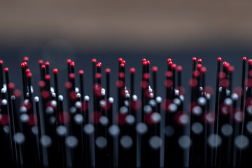 red and white plastic tips on the comb in black