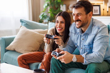 Couple having fun playing video games