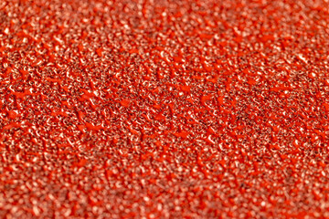 red coarse-grained sandpaper for working with wood and metal