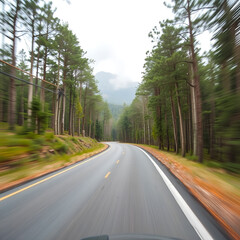 Obraz premium Country road between district to the city with motion blur, Journey way of traveler to the nature, Road in the mountain and the forest for travel to someplace, Asphalt road in the forest and no car.