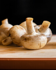  fresh mushrooms on a cutting board close-up