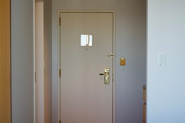 The White hotel room door