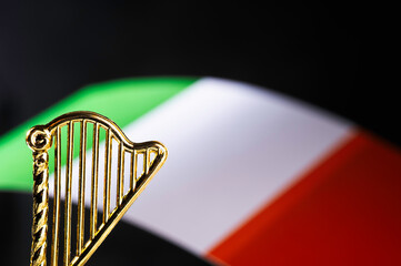 Saint Patricks Day. Saint Stephens Day. An Irish harp and flag against a black background