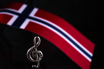 Norwegian Constitution Day. Norsk Hostfest. Eurovision. Nordic Music Days. National flag of Norway. Treble clef. Close-up front view.