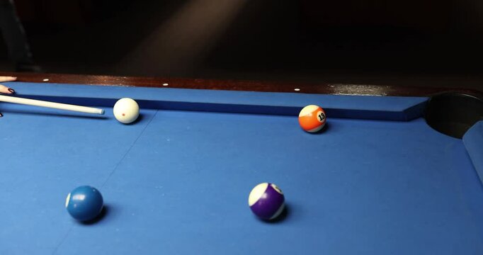A vibrant image of pool balls resting on a blue felt table, perfect for sports and recreation themes.