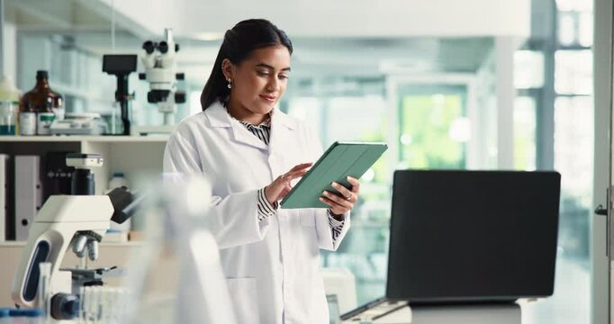 Woman, scientist and scroll on tablet in lab for research, medical report and record investigation. Person, digital and feedback for experiment, review checklist and healthcare information on vaccine