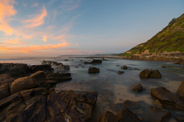 Calm view of rocky coastline in the morning.