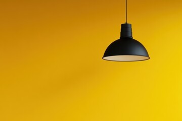 Obraz premium Black pendant lamp against yellow wall, interior design