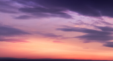 Sunset Sky,Cloud Background,Summer Sunrise over beach with sunlight reflection orange, pink, yellow, purple colour,Horizon Nature landscape dramatic golden hour of twilight dusk sky in evening Winter