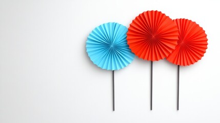 Colorful Paper Fan Decoration On White Surface