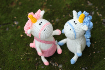 Knitted pink unicorn and blue unicorn, couple in love